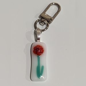 Floral Hand crafted  artisan bag charm of fused glass of single flower! OOAK